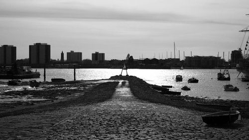 Scenic view of sea against sky in city