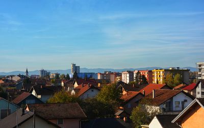 Buildings in city against sky