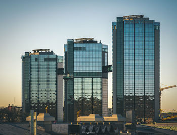 Modern buildings in city against sky