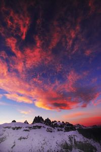 Scenic view of snow mountains against sky during sunset