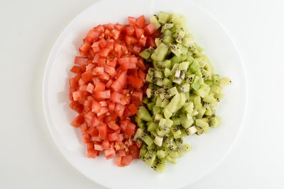 High angle view of chopped fruits in plate