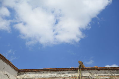 Low angle view of building against blue sky