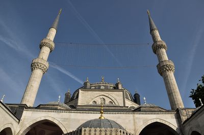 Low angle view of traditional building against blue sky