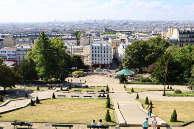 High angle view of buildings in city against sky