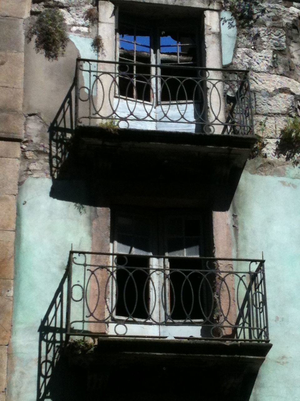 architecture, built structure, building exterior, railing, steps, window, staircase, low angle view, house, steps and staircases, building, reflection, day, outdoors, entrance, balcony, no people, old, residential structure, wall - building feature