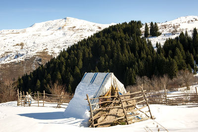 Scenic view of snow covered mountain against sky