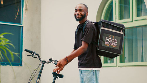 Young man riding bicycle