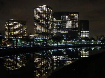 Illuminated buildings in city at night