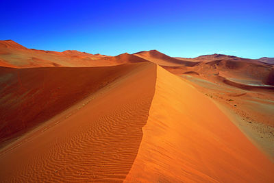 Scenic view of desert against clear sky