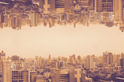 Double exposure photography of aerial cityscape in poor weather morning, haze of pollution