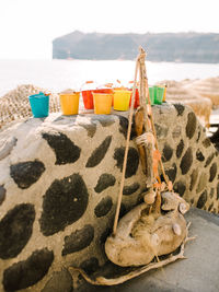 Close-up of drink on table at beach