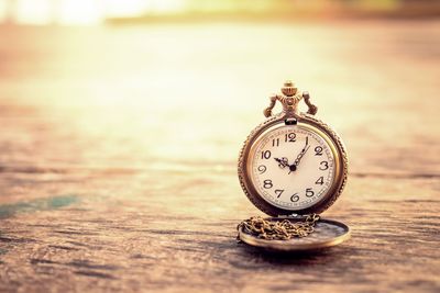 Close-up of clock on table