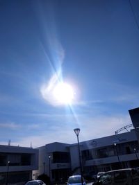 Buildings against sky on sunny day