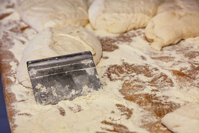 Production of baked bread in a bakery.