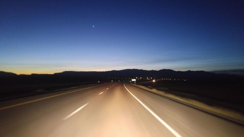 Road against sky at sunset