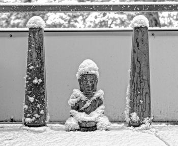 Statue of buddha during winter