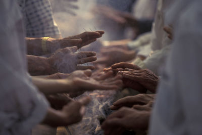 Cropped image of people getting acupuncture treatment