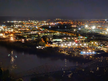 High angle view of illuminated buildings in city at night