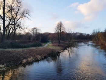 Scenic view of canal against sky