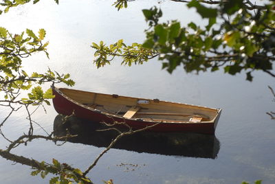 Abandoned boat in lake against sky