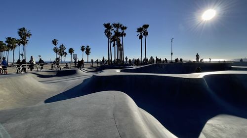 Palm trees on beach against clear sky