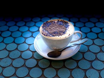 Close-up of coffee cup on table