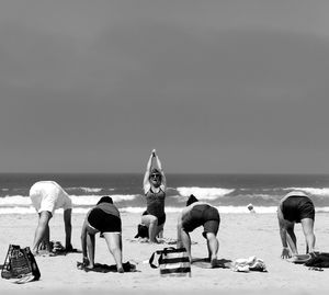 People relaxing on beach