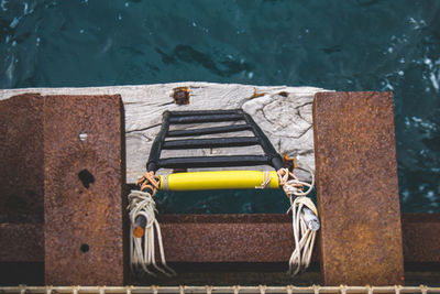 Directly above shot of ladder over sea