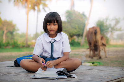 Portrait of girl studying outdoors