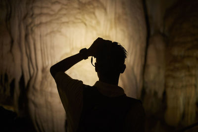 Silhouette man standing outdoors