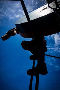 Low angle view of silhouette boat against sky