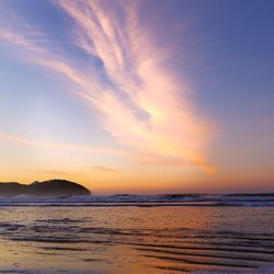 Scenic view of sea at sunset