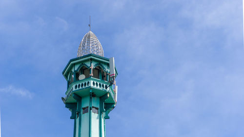 Low angle view of mosque tower against sky