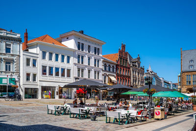 Buildings against blue sky in city