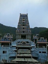 Buildings in city against clear sky