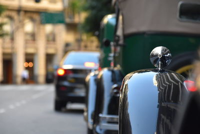 Rear view of car on street against clear sky