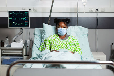 Portrait of woman sitting at hospital
