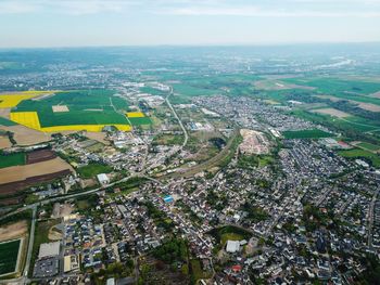High angle view of trees and buildings in city