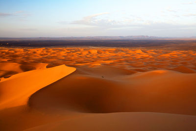 Scenic view of sand dunes at erg chebbi desert during sunset