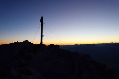 Silhouette mountain against clear sky at sunset