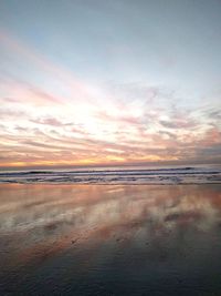 Scenic view of beach at sunset