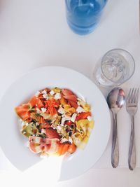 High angle view of fresh meal served on white table