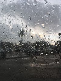 Full frame shot of wet glass window in rainy season