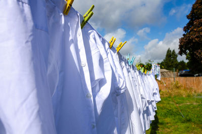 Clothes drying on clothesline against sky