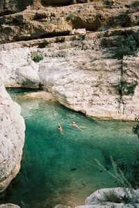 High angle view of cliff by sea