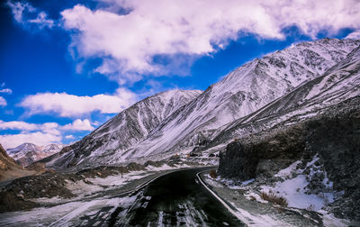 Scenic view of snowcapped mountains against sky