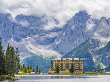 Scenic view of lake against cloudy sky