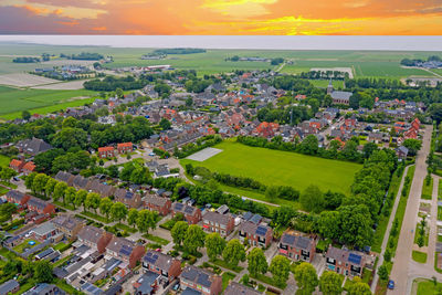 Aerial view on the medieval village ternaard in friesland the netherlands at sunset