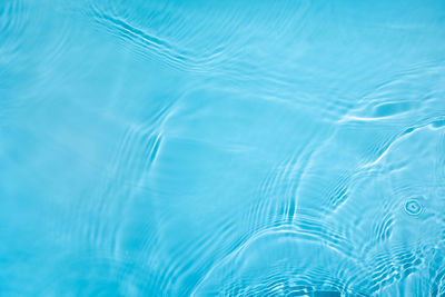 Transparent blue clear calm wave water surface texture