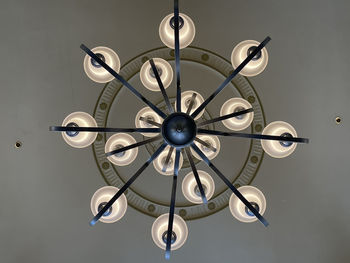 Photo from beneath a ceiling chandelier mandala